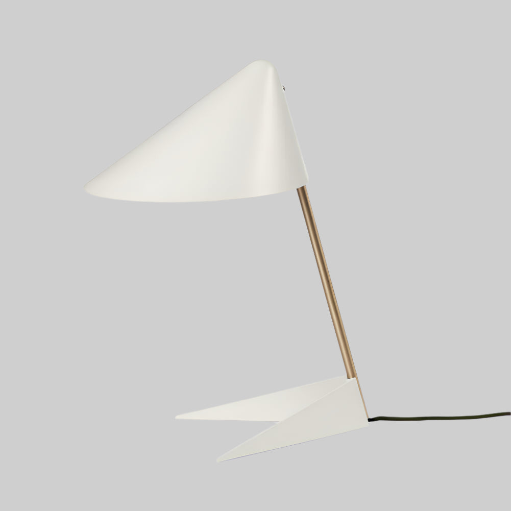 Modern table lamp with white cone shade and geometric base on a white background