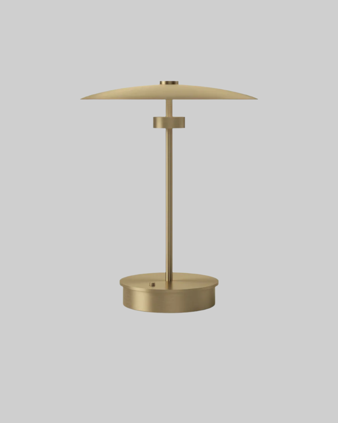 Gold table lamp on a white background