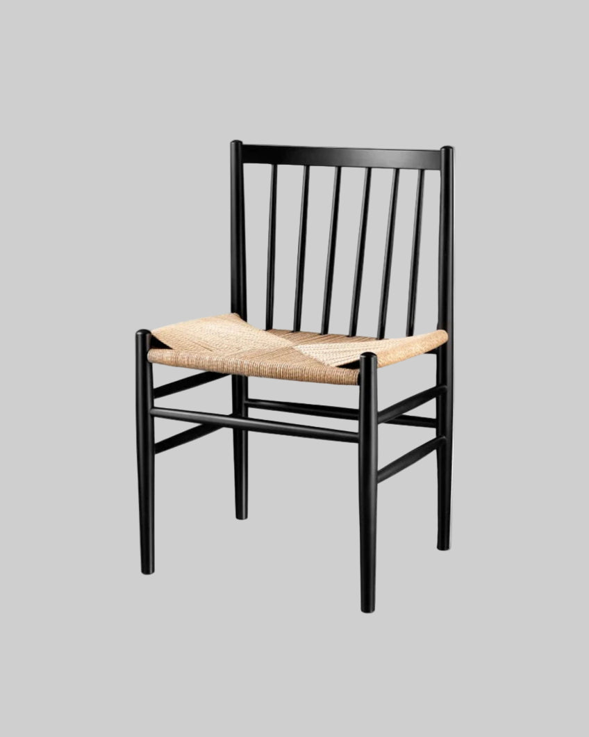 Black chair with woven seat on a white background