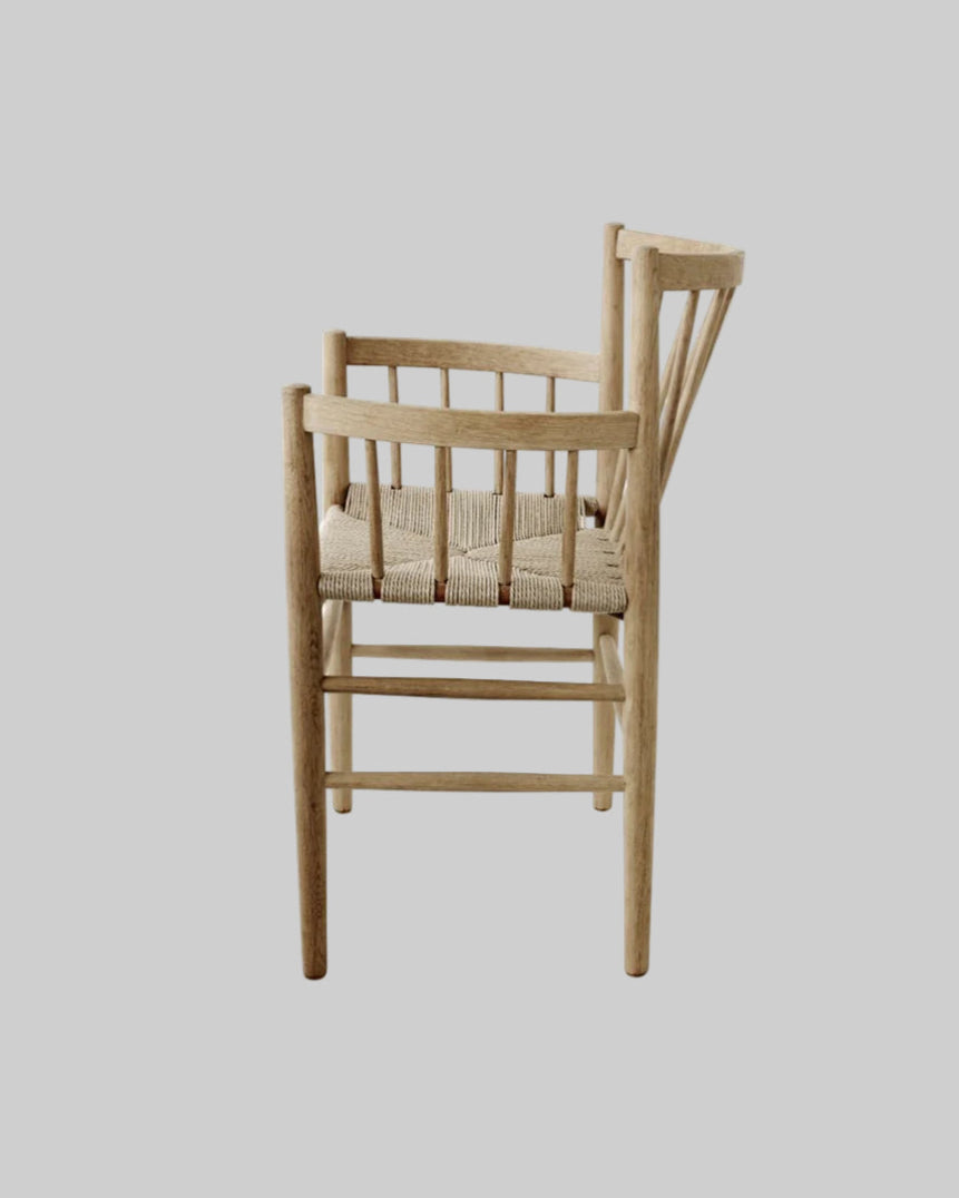 Wooden chair with woven seat on a white background