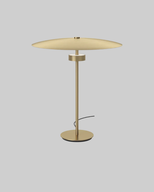 Gold table lamp on a white background