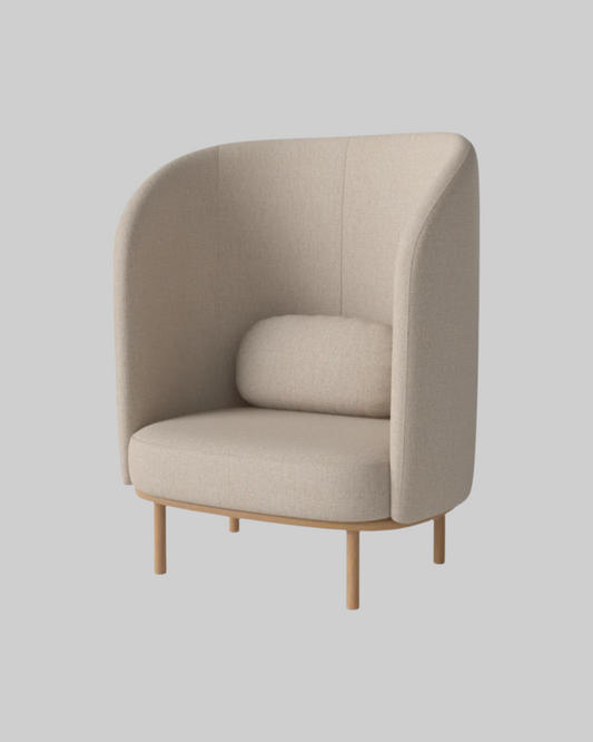 Beige armchair with wooden legs on a white background