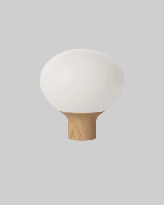 White spherical lamp with wooden base on a white background