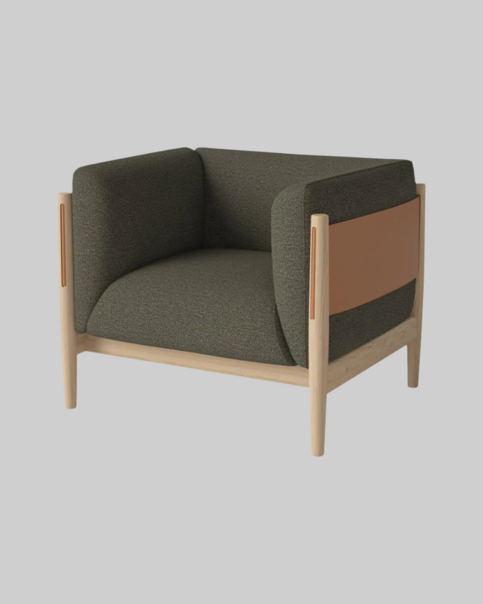 Modern armchair with green cushioned seat and backrest, wooden frame, and brown accent on a white background.