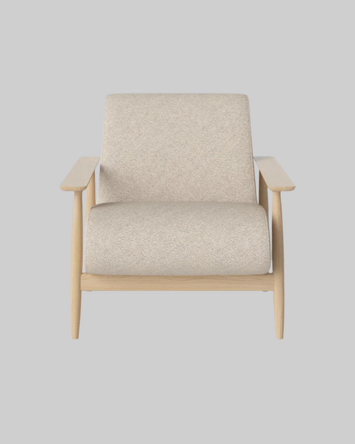 Beige armchair with wooden frame on a white background