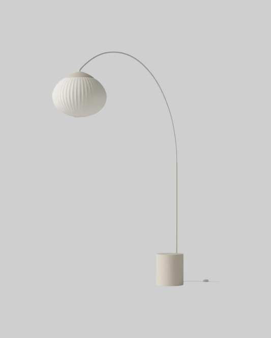 Modern floor lamp with a spherical shade on a white background