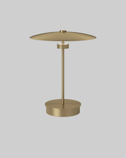 Gold table lamp on a white background