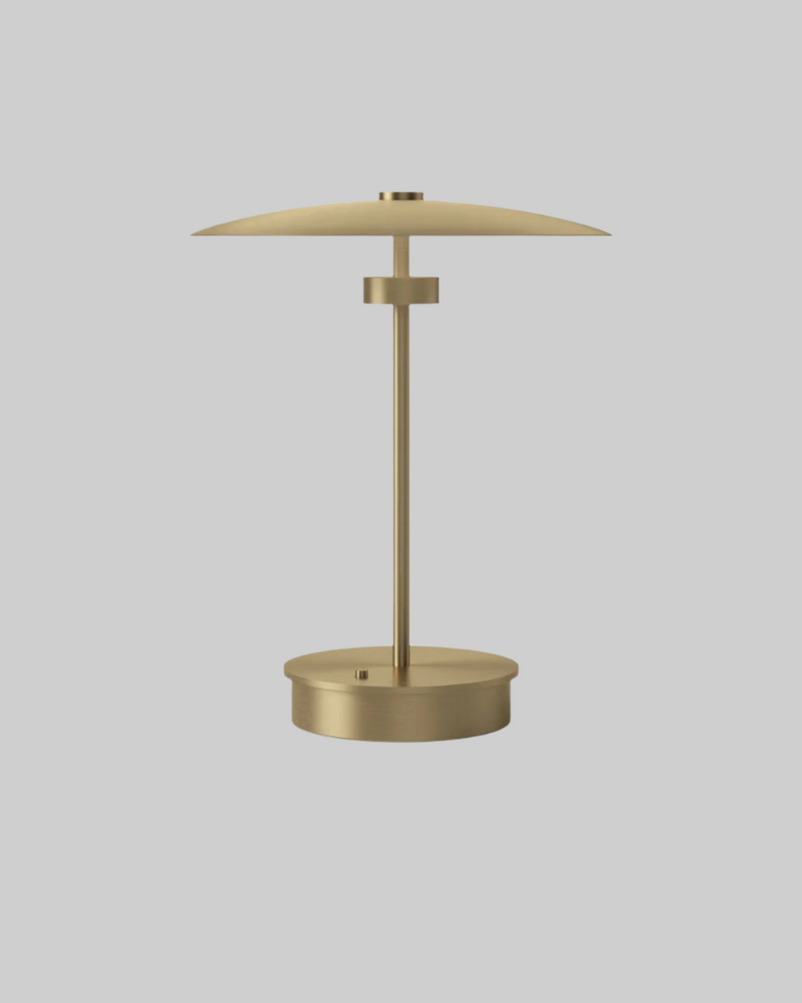 Gold table lamp on a white background