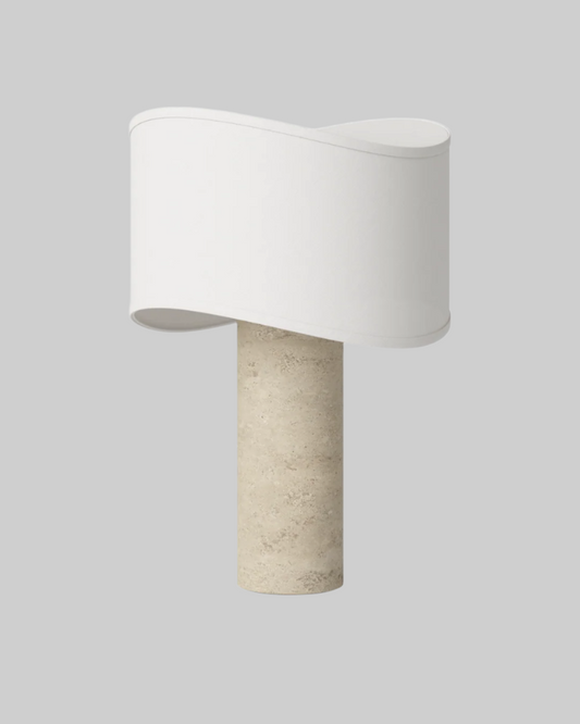 Table lamp with a white shade and beige base on a white background