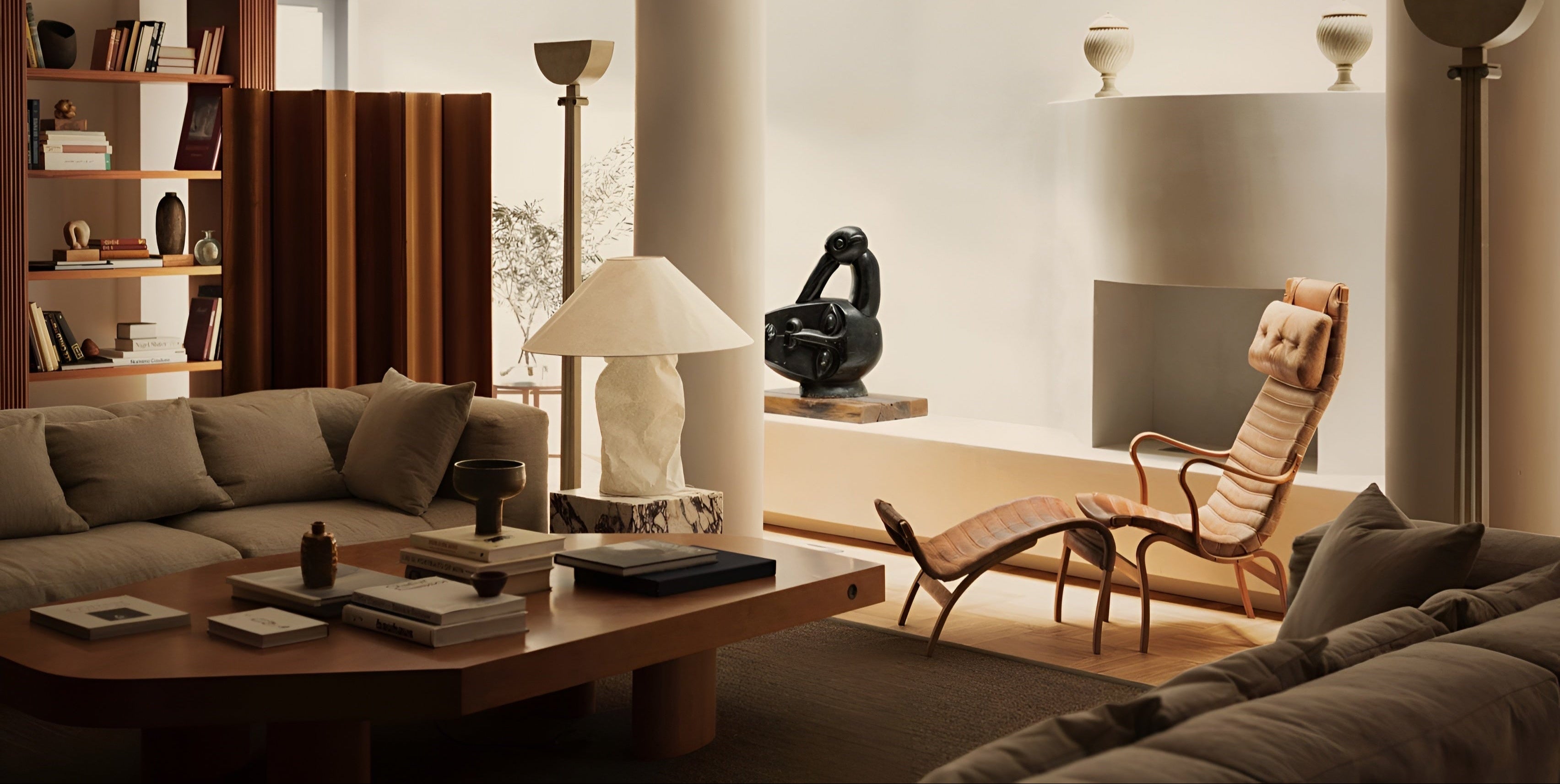 Modern living room with a sofa, coffee table, and armchair.